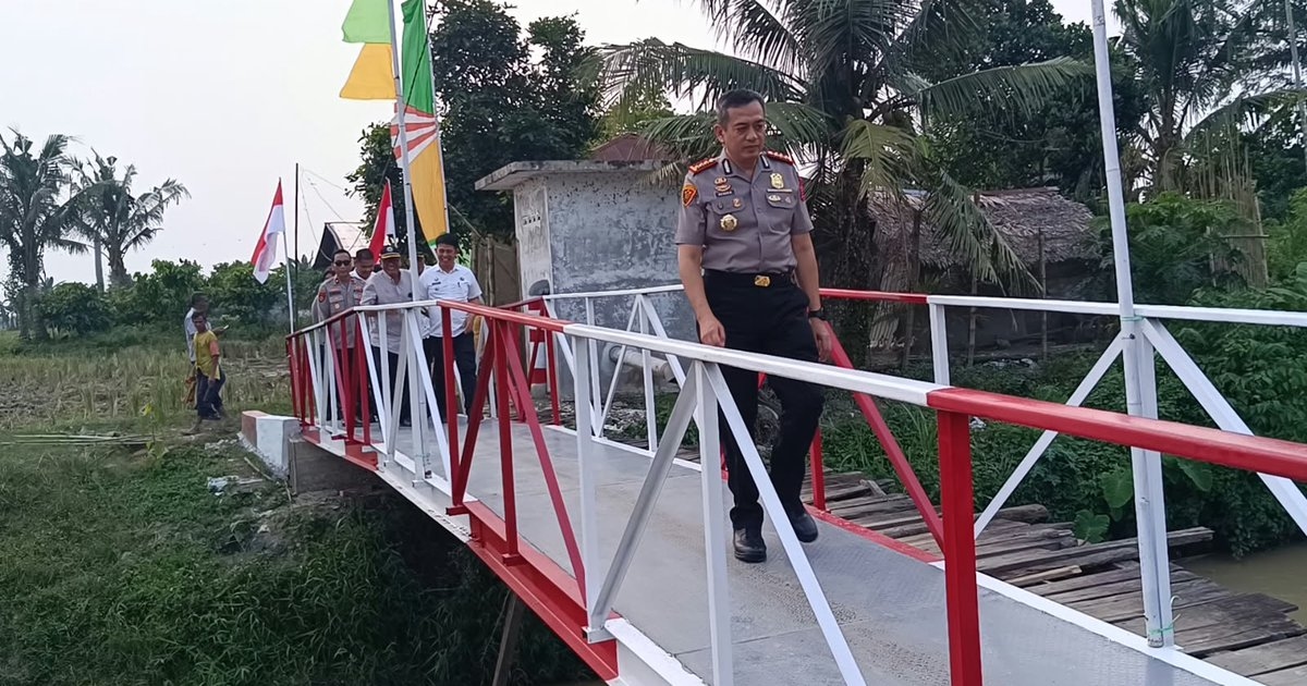 Akses Lumpuh Bertahun-tahun Berakhir! Jembatan Merah Putih Polresta Deli Serdang Buat Ekonomi Dua Desa Langsung Meledak